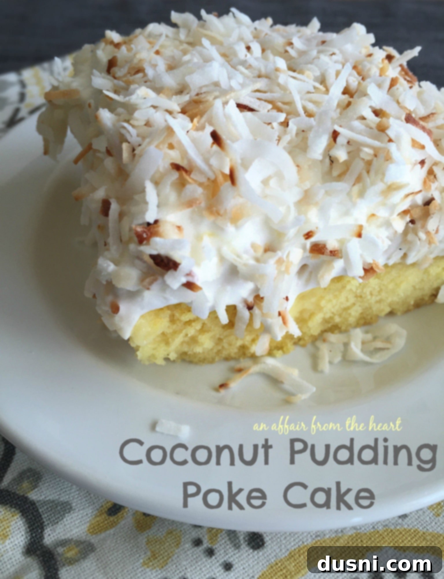 Coconut Pudding Poke Cake with layers of cake, pudding, and whipped cream