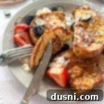 Close up of the Best French toast on a fork.