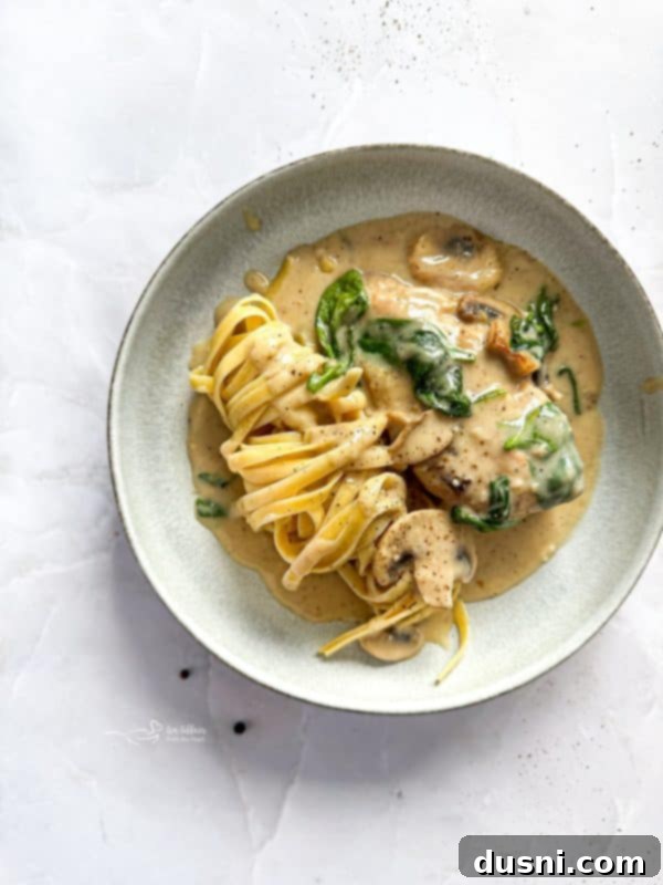 Creamy Chicken and Mushroom Florentine Pasta 17 A beautifully presented serving of Chicken Mushroom Florentine Pasta.