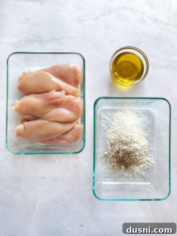 Creamy Chicken and Mushroom Florentine Pasta 5 A generous serving of Chicken Mushroom Florentine Pasta in a white bowl, ready to eat.