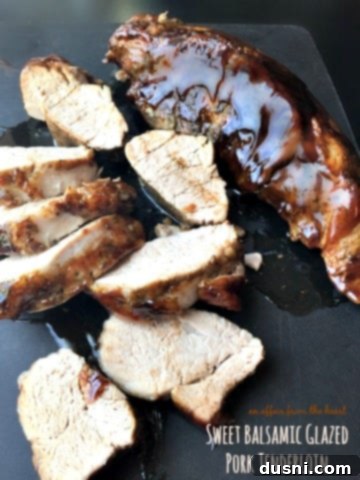 Sweet Balsamic Glazed Pork Tenderloin, beautifully roasted and sliced, showcasing its glossy glaze.