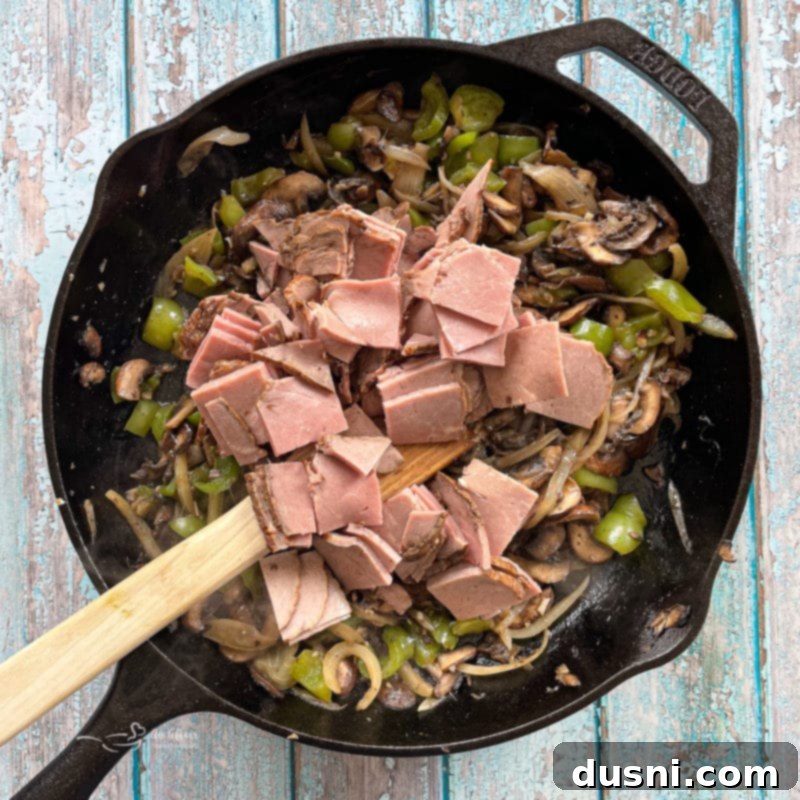 Loaded Philly Cheese Steak Peppers 12 adding the steak to the mushroom and peppers mixture