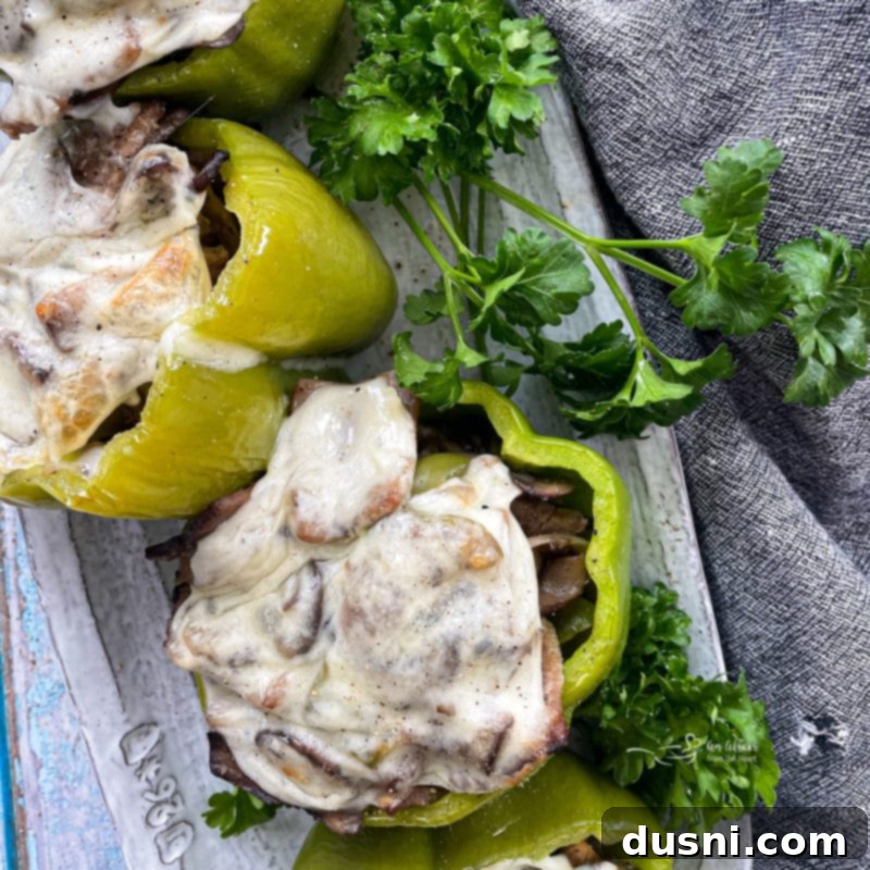 Loaded Philly Cheese Steak Peppers 14 close up of philly cheesesteak stuffed peppers on a plate