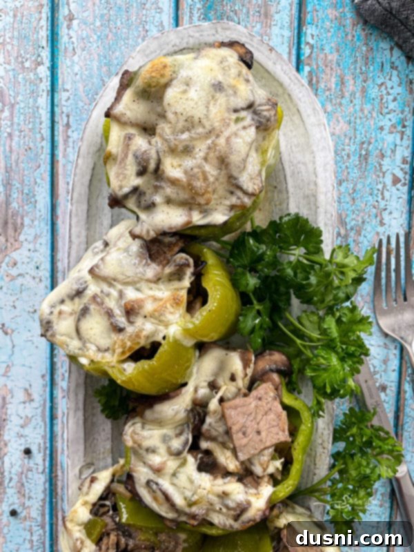 Loaded Philly Cheese Steak Peppers 3 stuffed peppers with philly cheesesteak and garnishes