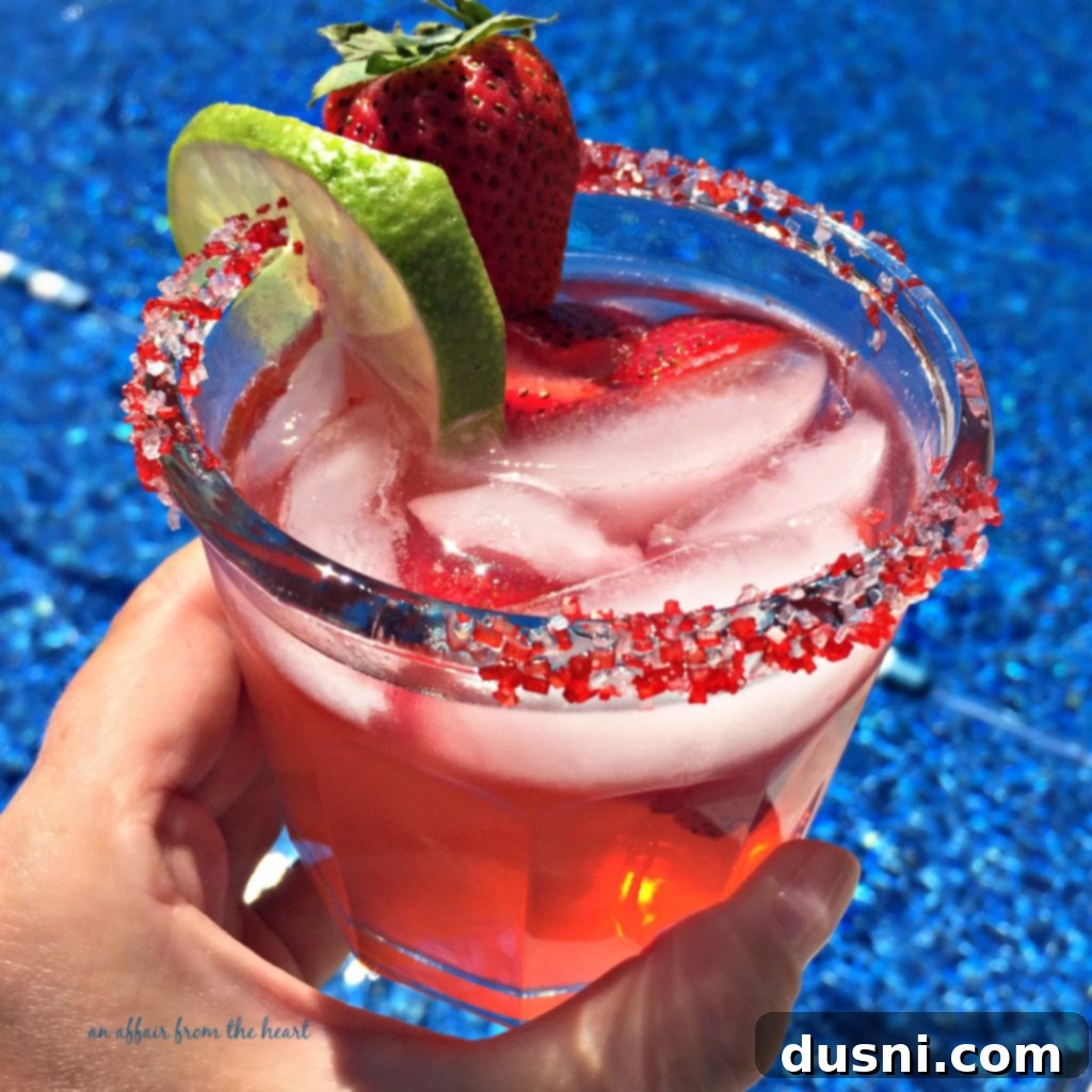 Summertime Strawberry Margaritas 2 Refreshing pitcher of Sauza Strawberry Margaritas with fresh strawberries and limes