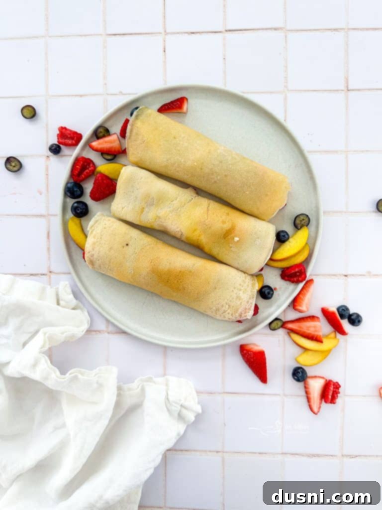 Golden Crepes Topped with Summer Fruits 11 Rolled sweet crepes with summer fruits