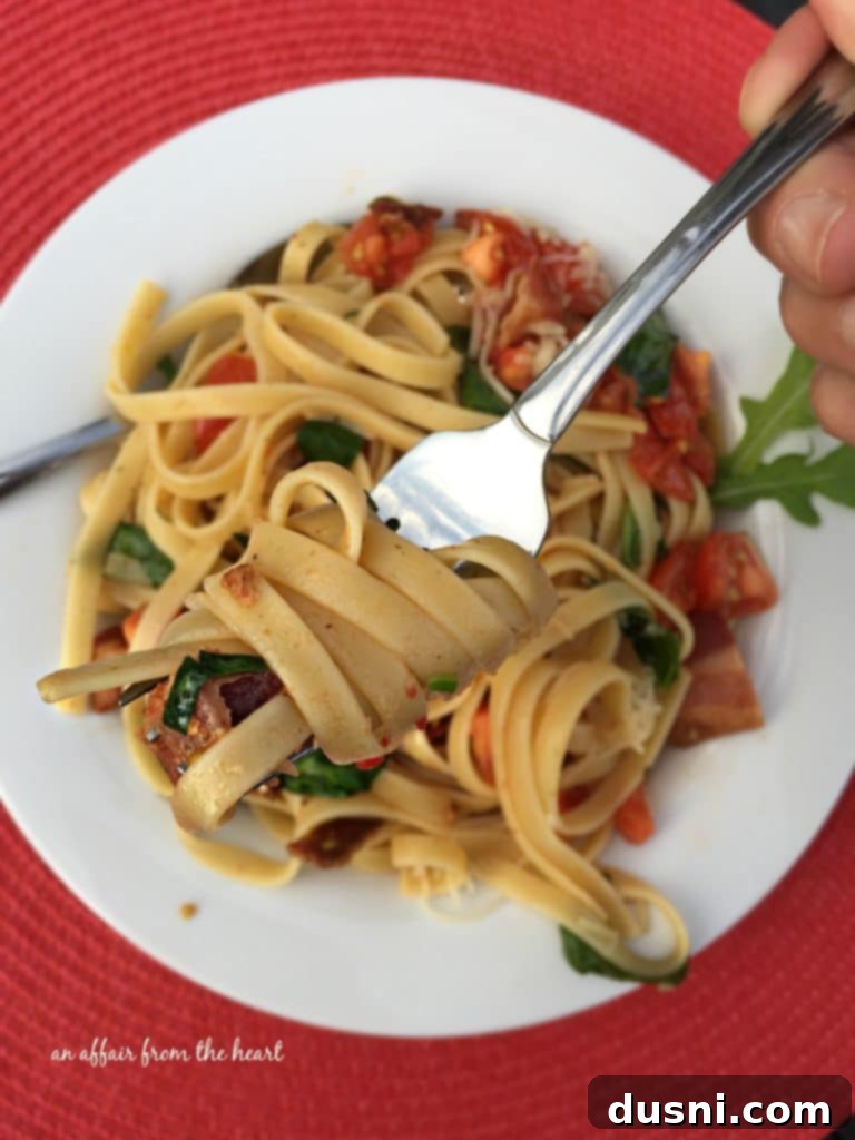Close-up of BLT Pasta in a white bowl