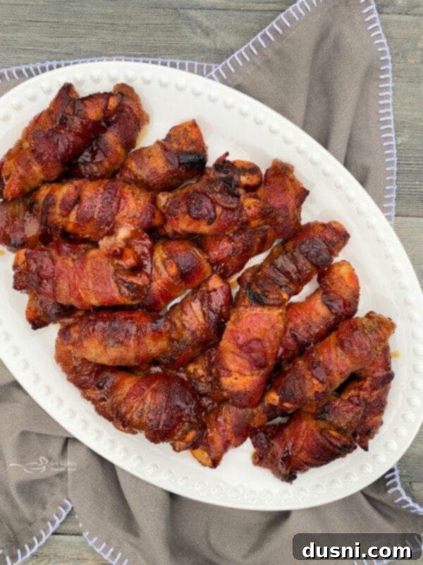 Sweet Heat Bacon-Wrapped Chicken 3 Sweet & Spicy Chicken pieces on a baking sheet before cooking