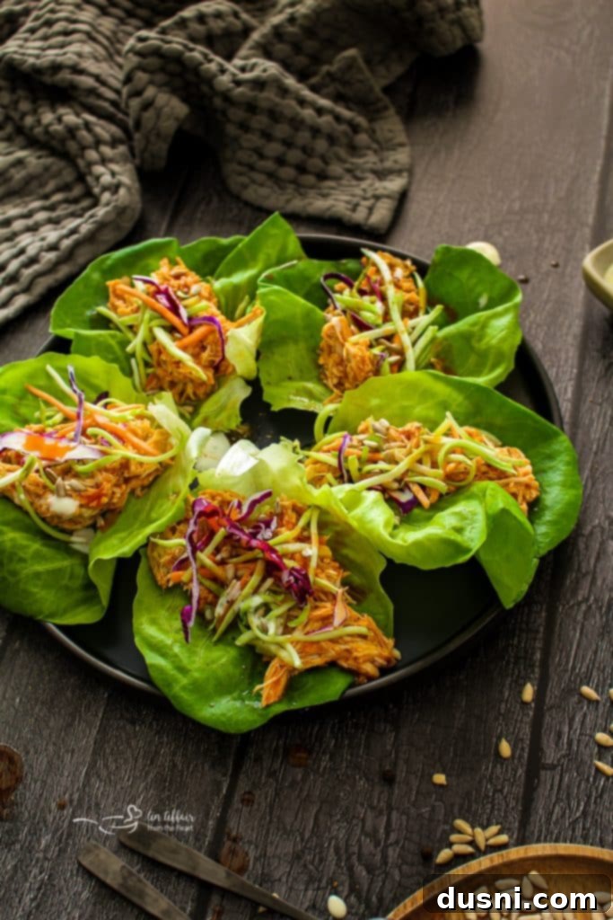 Spicy Buffalo Chicken Lettuce Cups 3 Buffalo Chicken Lettuce Wraps with sauce and ingredients