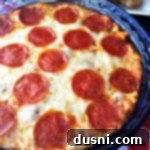 Pizza Dip in a blue dish with text "pizza dip"