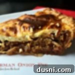 Close up of a slice of German Onion Pie, text "German Onion Pie {Zwiebelkuchen}"