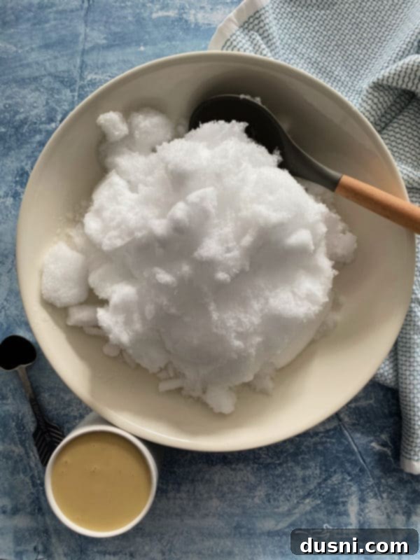 A close-up of the smooth, creamy texture of freshly made snow ice cream.