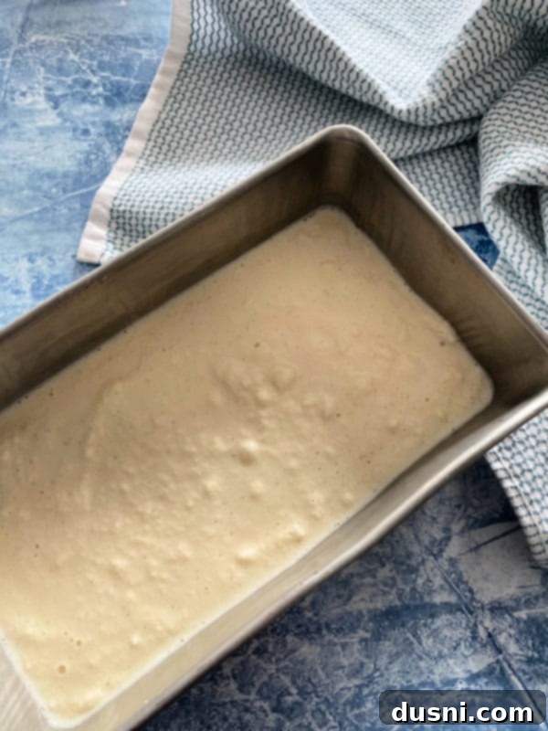 The snow ice cream mixture now looks more uniform and slushy, having been thoroughly combined.