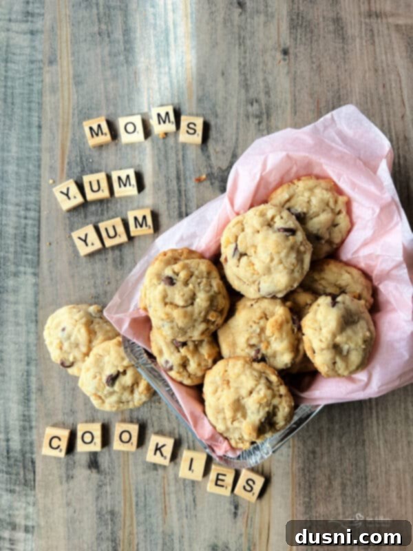 Grandma Jane's Signature Oatmeal Raisin Treats 13 Moms Yum Yum Cookies spelled out in wooden tiles with a bowl full of cookies next to them.