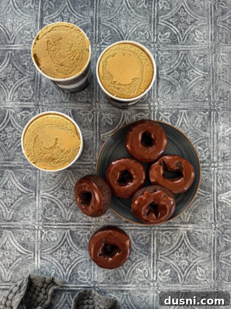 A selection of Dunkin' Donuts Double Chocolate Donuts and a carton of coffee ice cream, the two main ingredients.