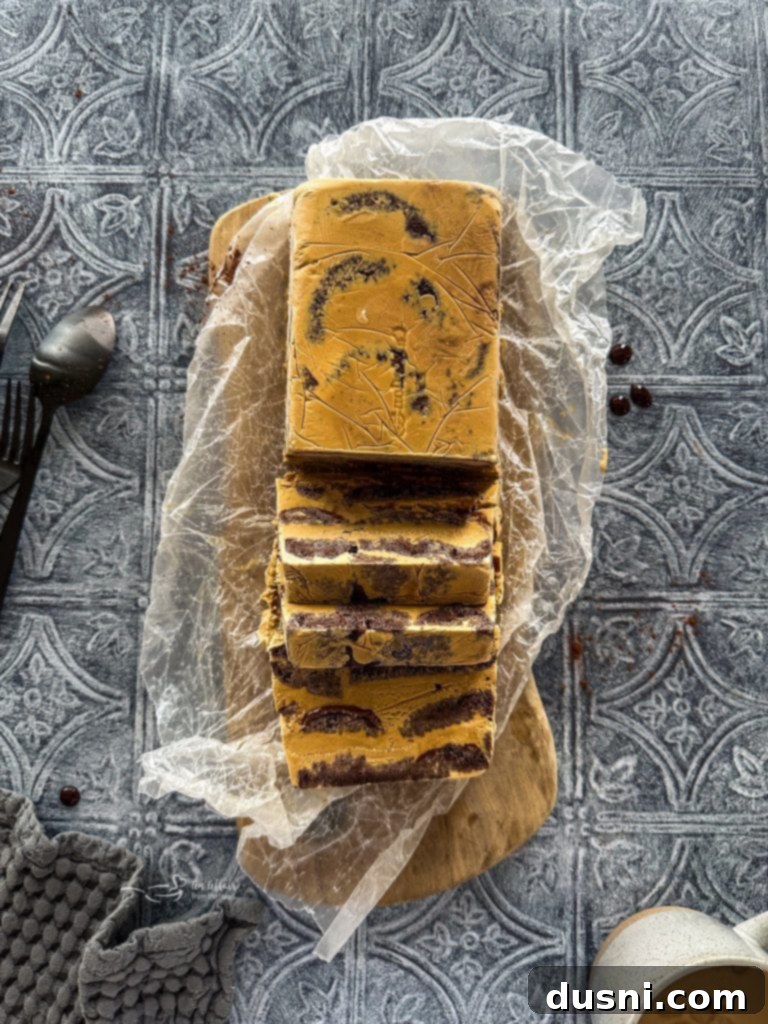 Coffee and donuts ice cream cake layers being assembled in a loaf pan.