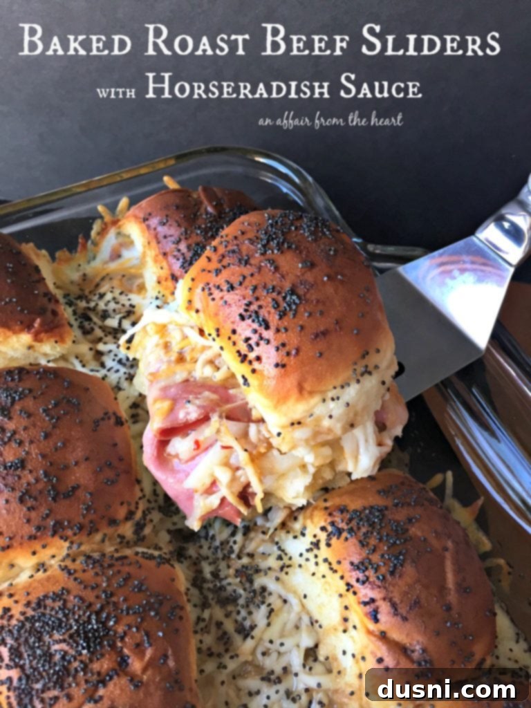 Baked Roast Beef Sliders with Horseradish Sauce, golden brown and bubbly from the oven.