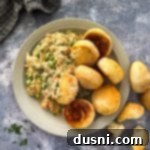 Overhead of Chicken à la King and biscuits in a bowl.