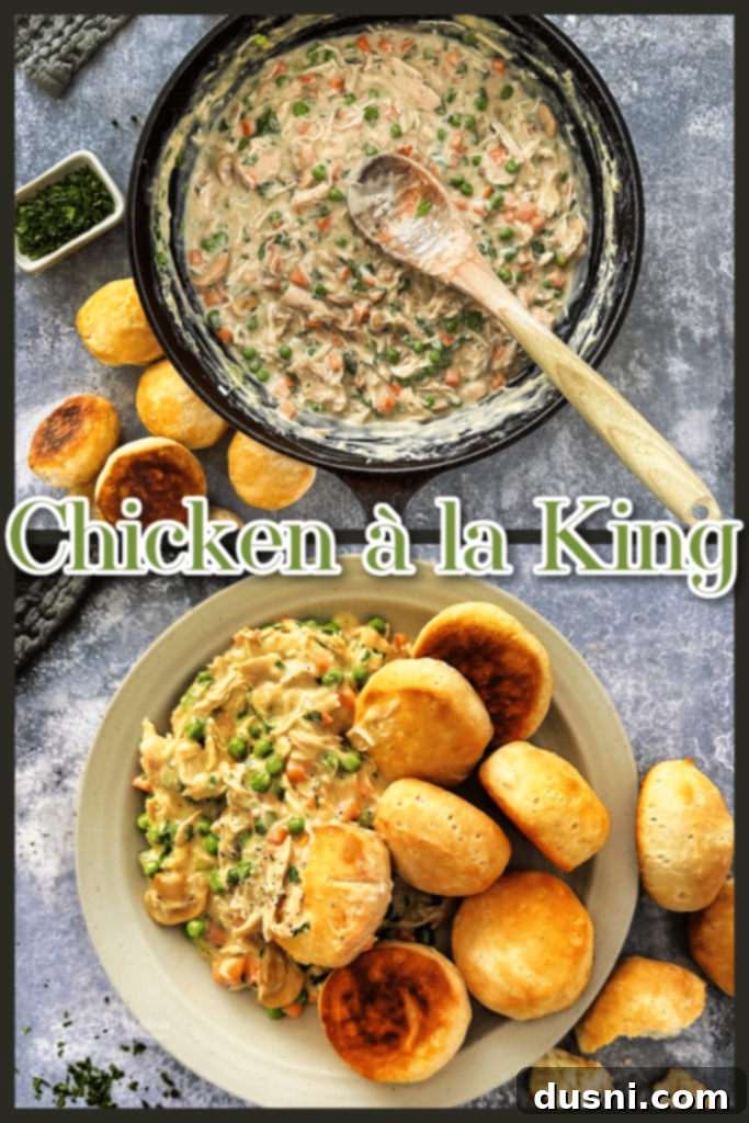 Serving of Chicken à la King in a bowl with a fork, showing the creamy sauce and vegetables.