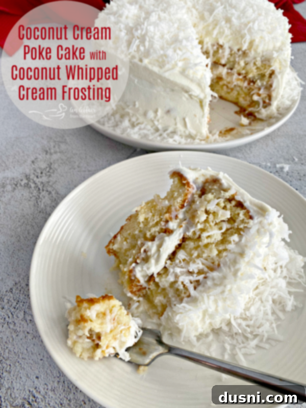 A stunning hero shot of the Coconut Cream Poke Cake with Coconut Whipped Cream Frosting.