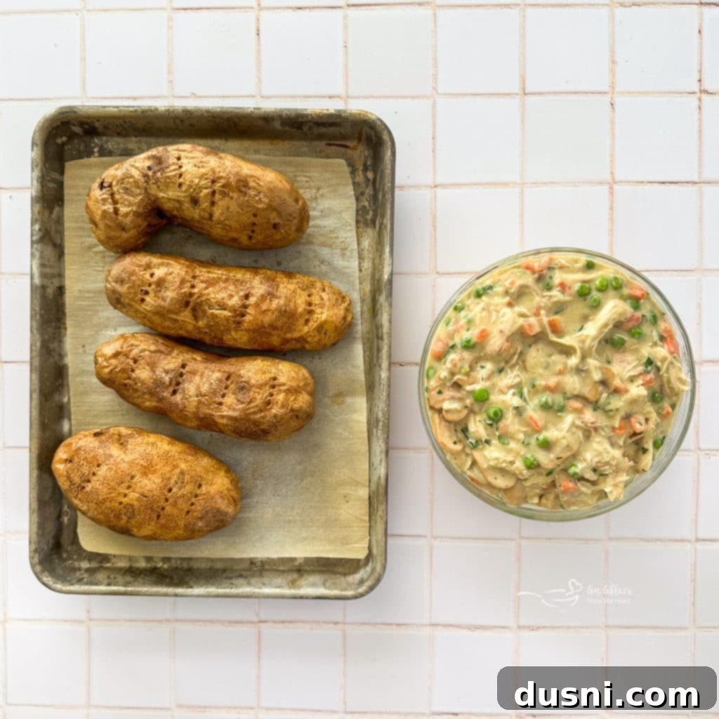 Close-up of prepared Chicken à la King filling being scooped from a pot