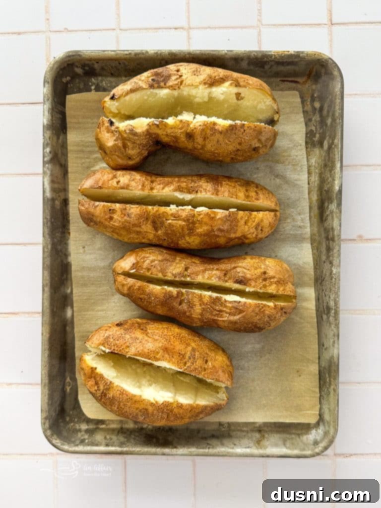 A fluffy baked potato, perfectly cooked and ready for filling