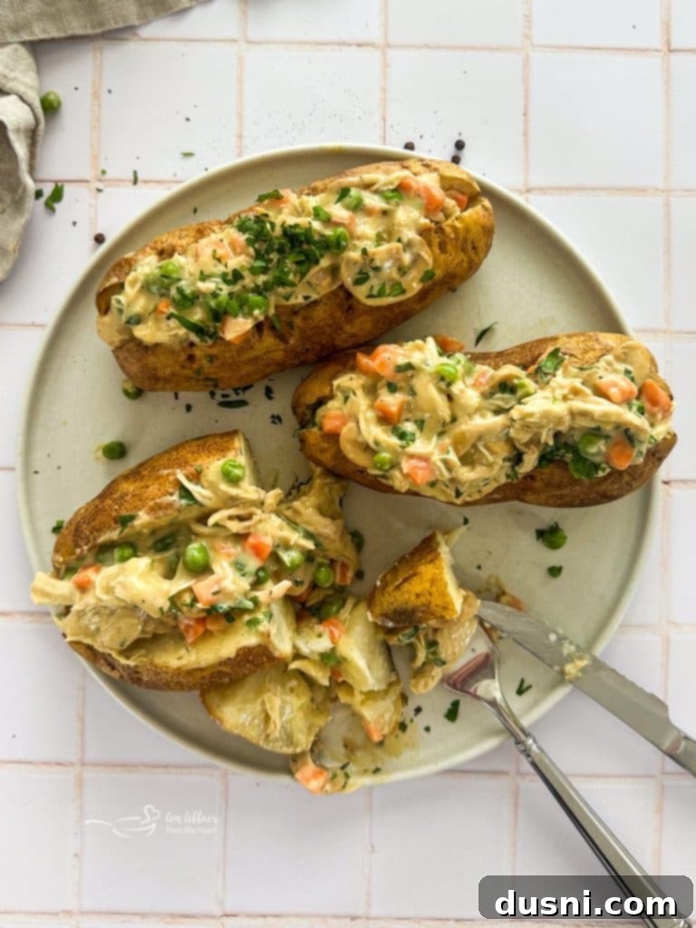 Pinterest-friendly vertical image of Chicken à la King Baked Potatoes with recipe title