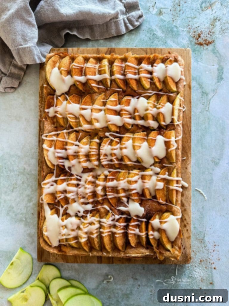 Traditional German Apple Kuchen 11 Drizzling vanilla glaze over cooled Apple Kuchen.
