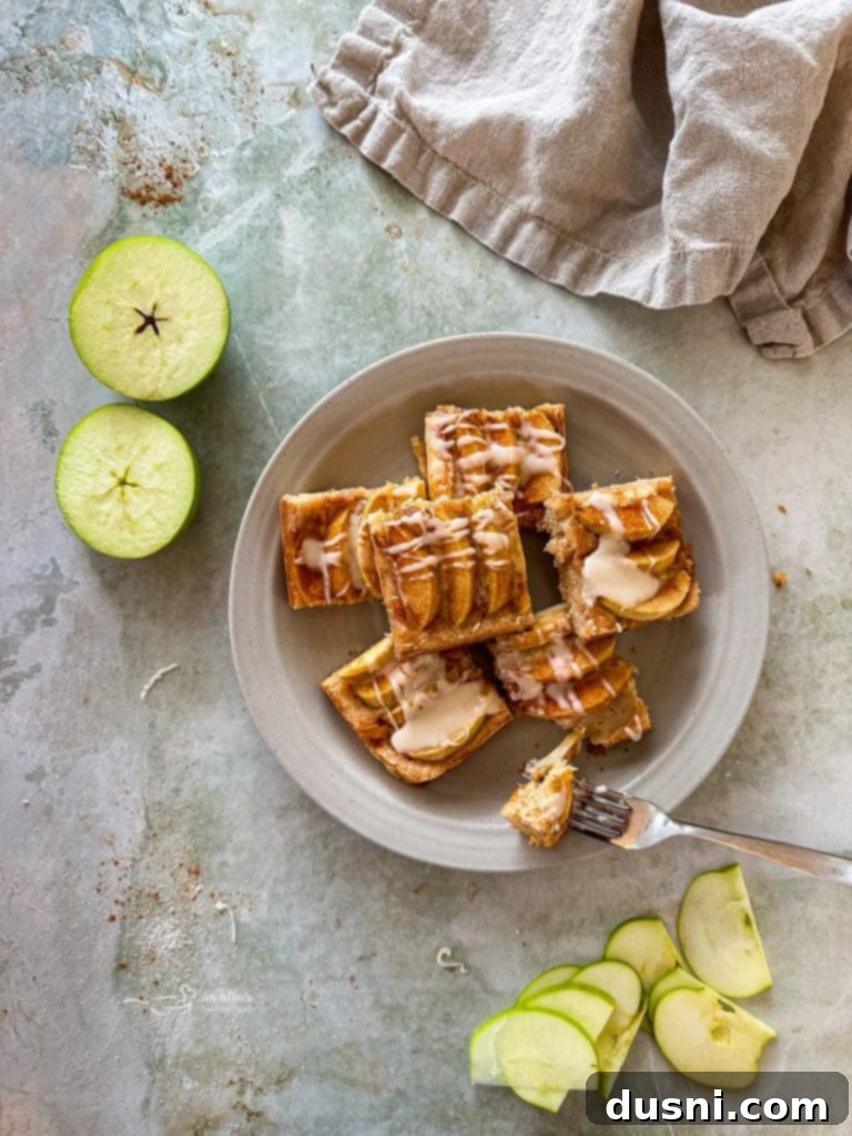 Traditional German Apple Kuchen 4 Apple Kuchen cooling on a wire rack, freshly baked.