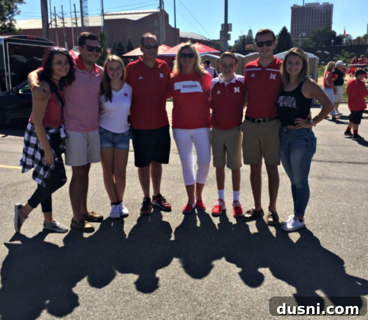Hearty Brat Burgers 3 Family gathered enjoying a tailgate party