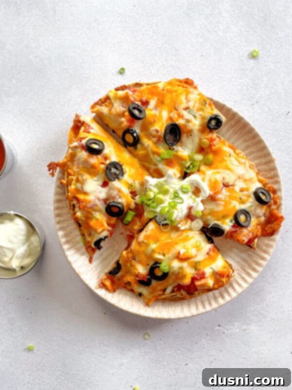 A homemade Taco Bell Mexican Pizza, freshly baked and ready for slicing.