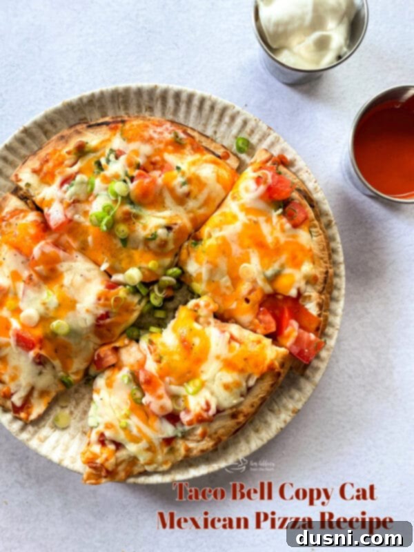 Close-up of a homemade Mexican Pizza with a crispy golden-brown tortilla.