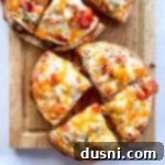 Taco Bell Mexican Pizzas cut on wooden board