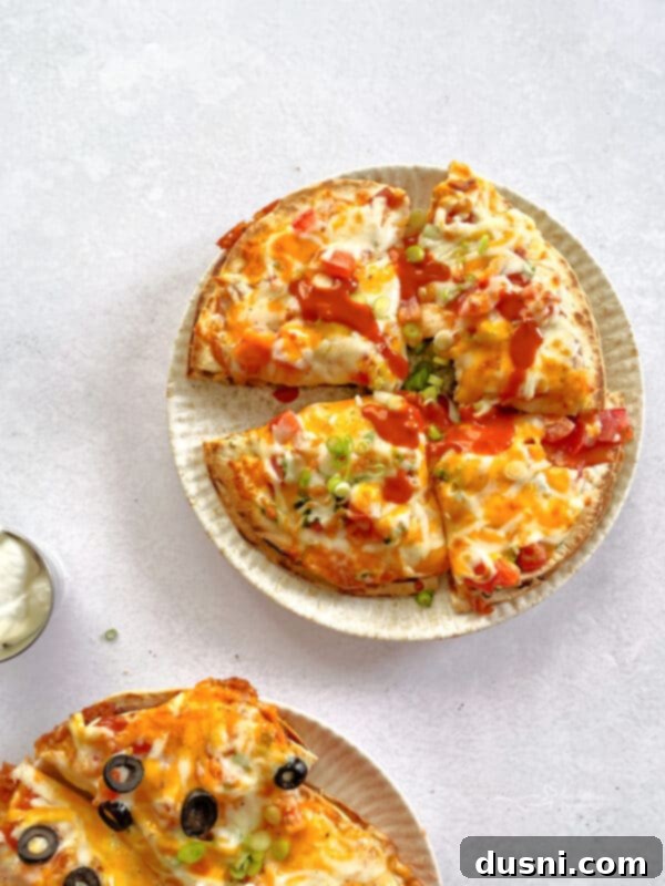 A finished homemade Taco Bell Mexican Pizza, sliced and ready to eat.