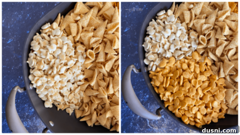 Assorted crackers, pretzels, and nuts are poured into a large roasting pan.