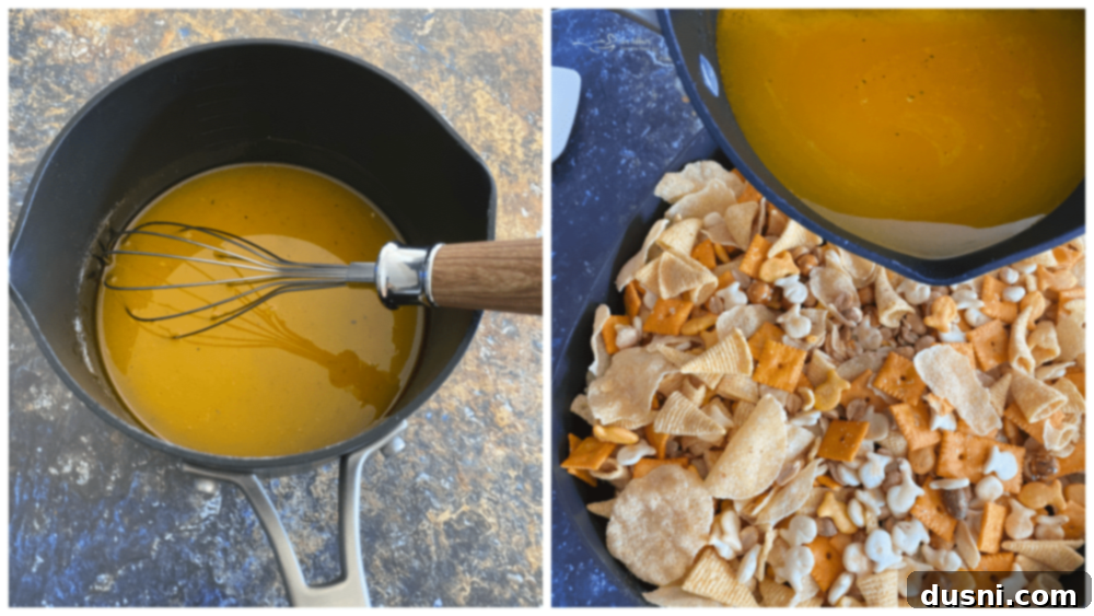 Popcorn oil and ranch seasoning mixture being poured over the dry snack mix in the roasting pan.