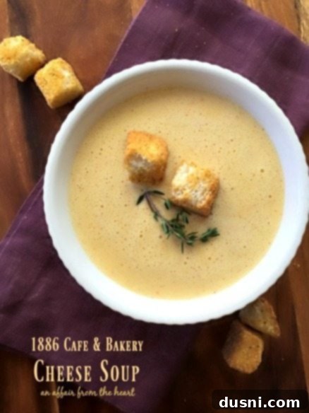 A comforting bowl of 1886 Cafe & Bakery Cheese Soup, garnished with croutons, from The Driskill Hotel in Austin, TX