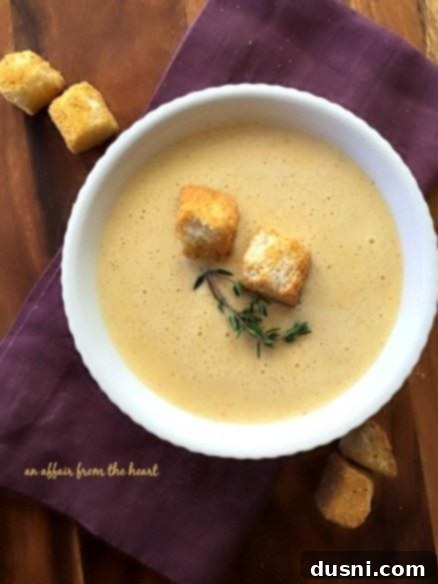 The finished 1886 Cafe & Bakery Cheese Soup served in a bowl, ready to be enjoyed with Texas Toast Croutons