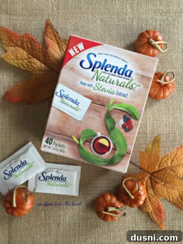 A hand holding a perfectly baked Pumpkin Pie Croissant Bundle