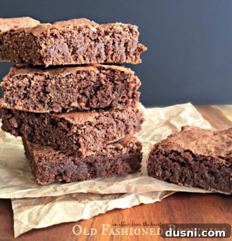 Grandma's Classic Fudgy Brownies 9 Old Fashioned Brownies - stacked brownies on a napkin
