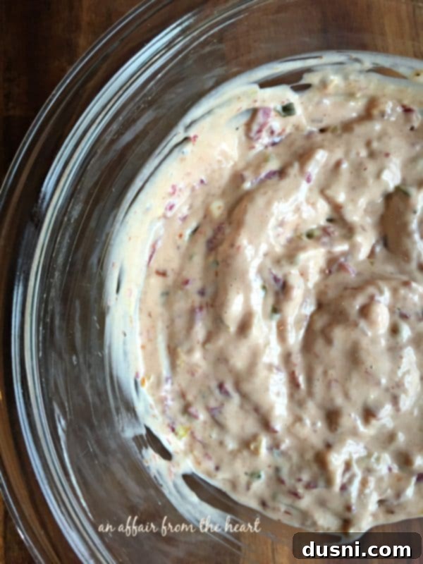 Reuben Brats: Slow-Cooked, Savory, Sensational 7 Spreading Reuben sauce onto a hoagie roll