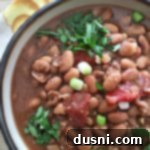 overhead of Southwestern Pinto Bean Soup in a white bowl