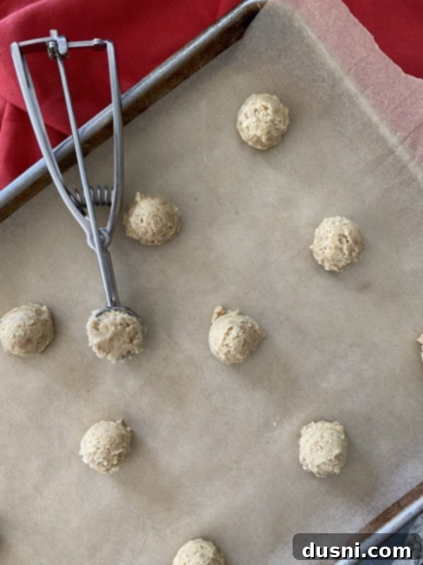 Golden Toffee Crunch Cookies 9 Preparing Butter Brickle Cookie dough with toffee bits mixed in, ready for scooping