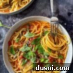 A fork twirling the pasta in a bowl of Italian Wonder Pot.