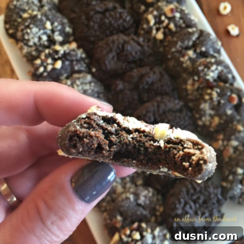 A batch of Dark Chocolate Molasses Cookies cooling on a rack