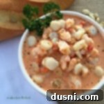 Velvety Tomato Seafood Bisque 12 Overhead of Creamy Tomato Seafood Bisque in a white bowl