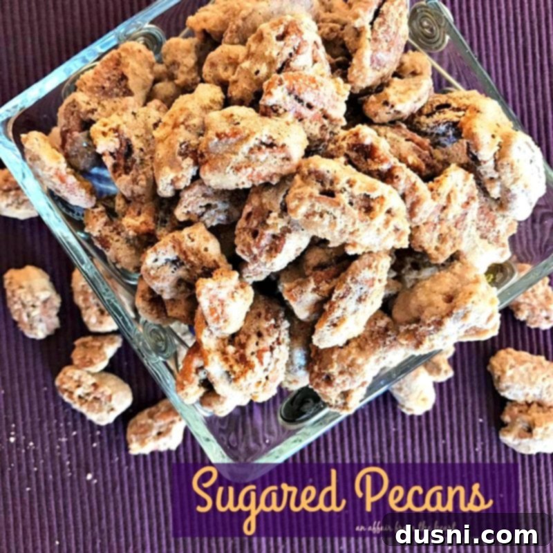 Candied Pecans 5 A close-up shot of a small pile of freshly made sugared pecans, perfect for snacking.