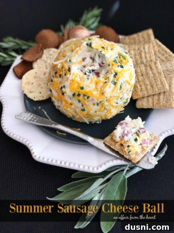 The Ultimate Summer Sausage Cheese Ball 12 A festive Summer Sausage Cheese Ball on a cutting board, ready to be served.