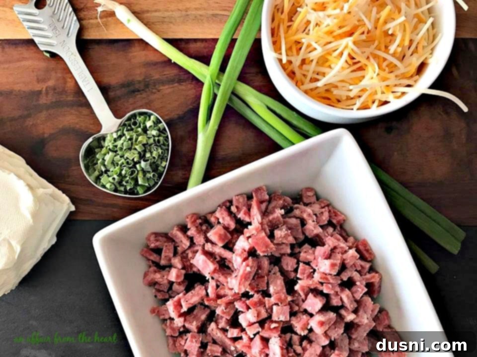 The Ultimate Summer Sausage Cheese Ball 14 Ingredients for Summer Sausage Cheese Ball: cream cheese, shredded cheese, green onions, chives.