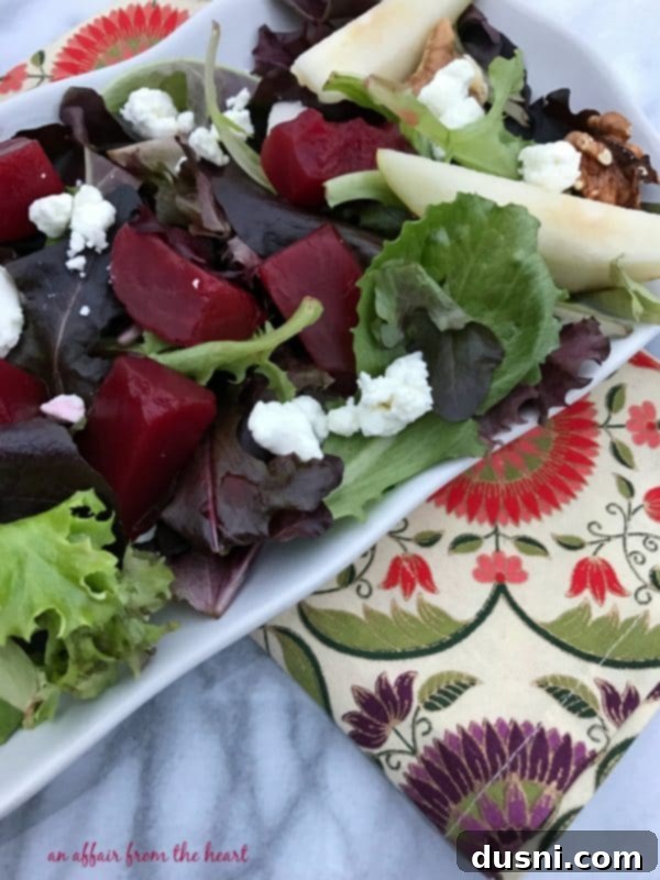 Beautifully plated Pickled Beet Salad with Pears, Walnuts & Goat Cheese